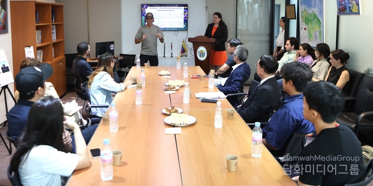 Venezuelan Olympic BMX medalist Daniel Dhers (left, standing) answers questions raised by reporters at a press conference at the headquarters of the Venezuelan Embassy in Seoul on May 20, 2024.