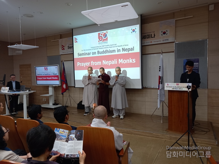 Three Nepali monks pray before the opening of seminar on Buddhism in Nepal titled "Historiography of Pre-enlightenment Background and Later Practices of Buddhism in Nepal" at Dongguk University in Seoul on May 24, 2024.