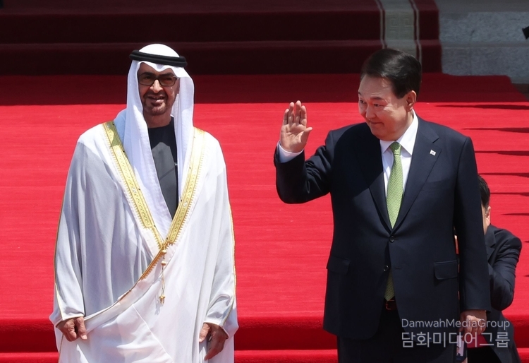 South Korean President Yoon Suk-yeol (right) waves during an official welcome ceremony for United Arab Emirates (UAE) President Mohamed bin Zayed Al Nahayan during his state visit to South Korea at the lawn in front of the presidential office in Yongsan, Seoul, South Korea on May 29.