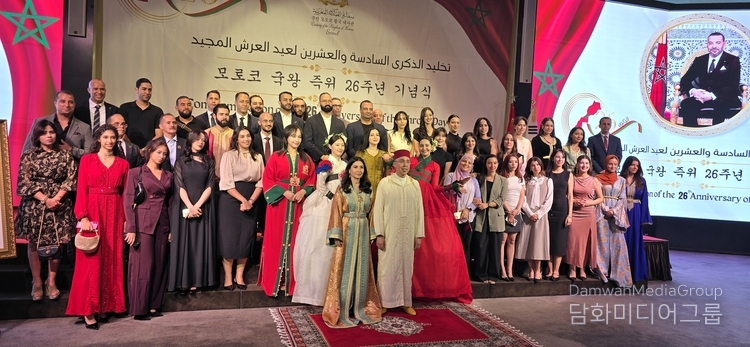 Ambassador Chafik Rachadi and Mrs. Leila Chelly Rachadi (center) take a group photo with foreign ambassadors, senior diplomats and other local and international dignitaries.