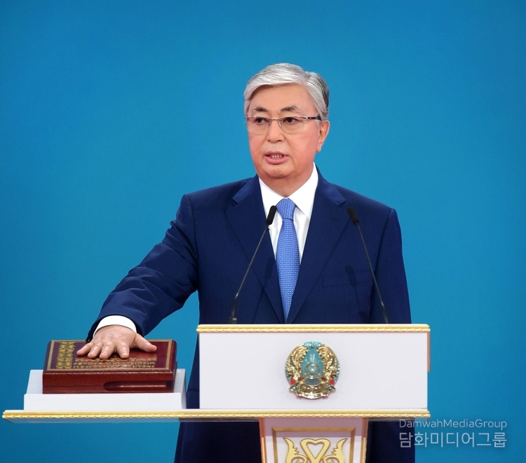 President Kassym-Jomart Tokayev places his hand on the Constitution of the Republic of Kazakhstan